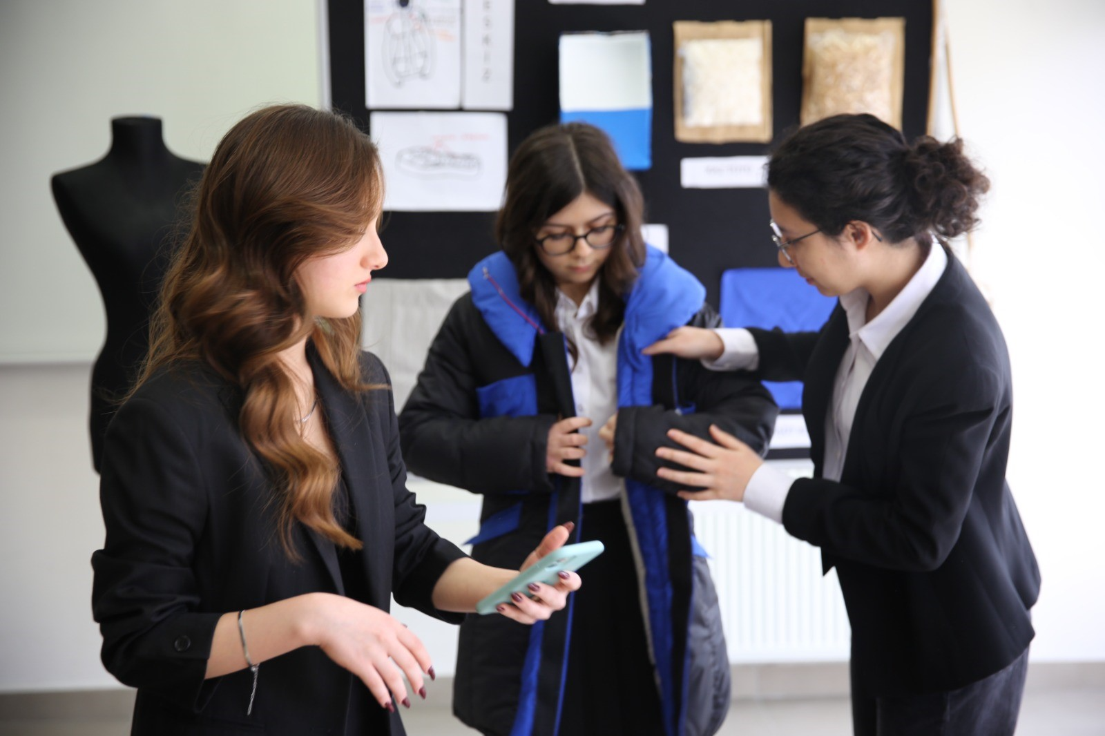 Ela wearing the innovation in bio wear, wearable technology inspired by nature, she co-invented with two other members of her high school science club, the Cosmos Club.