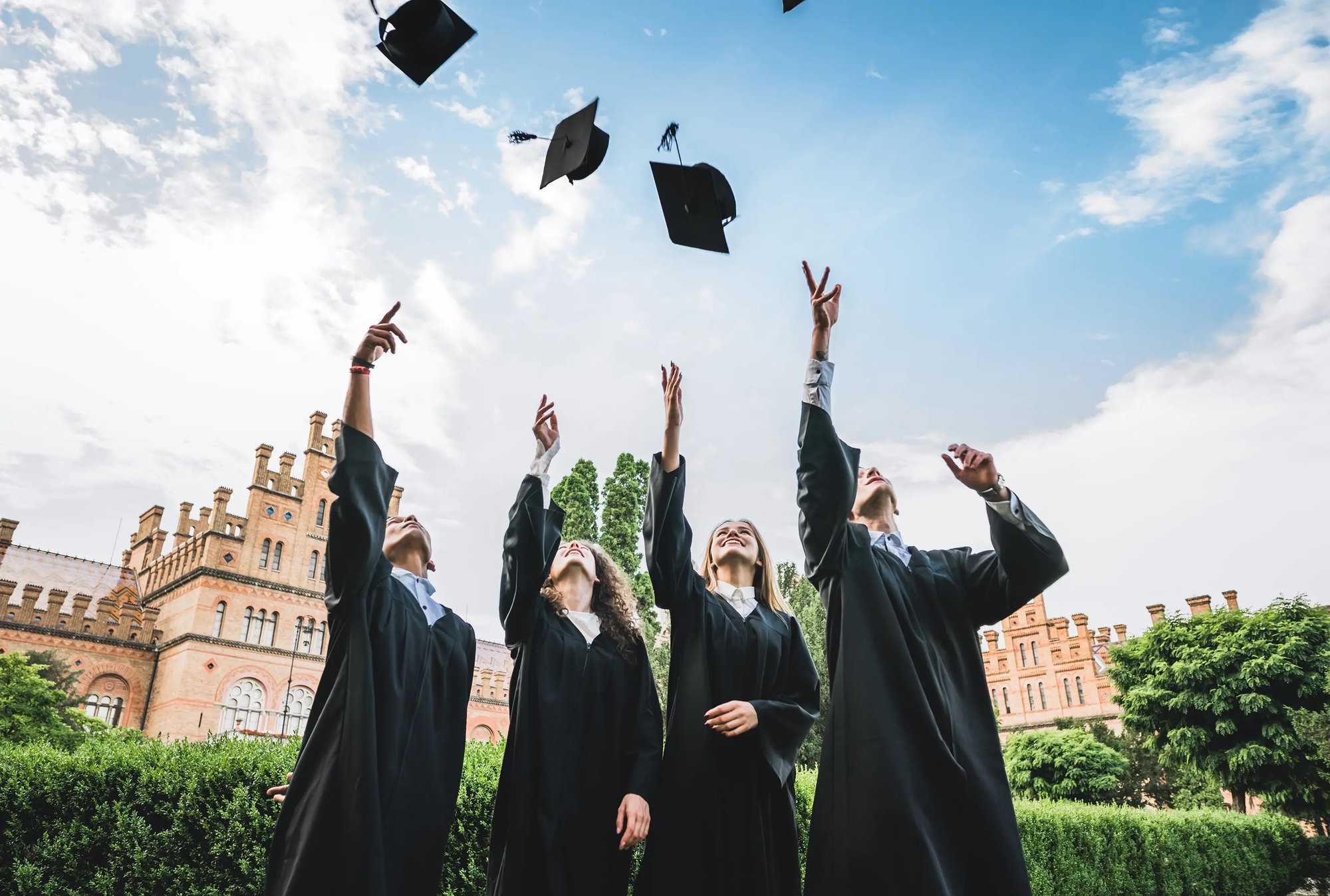 Student grads throwing caps