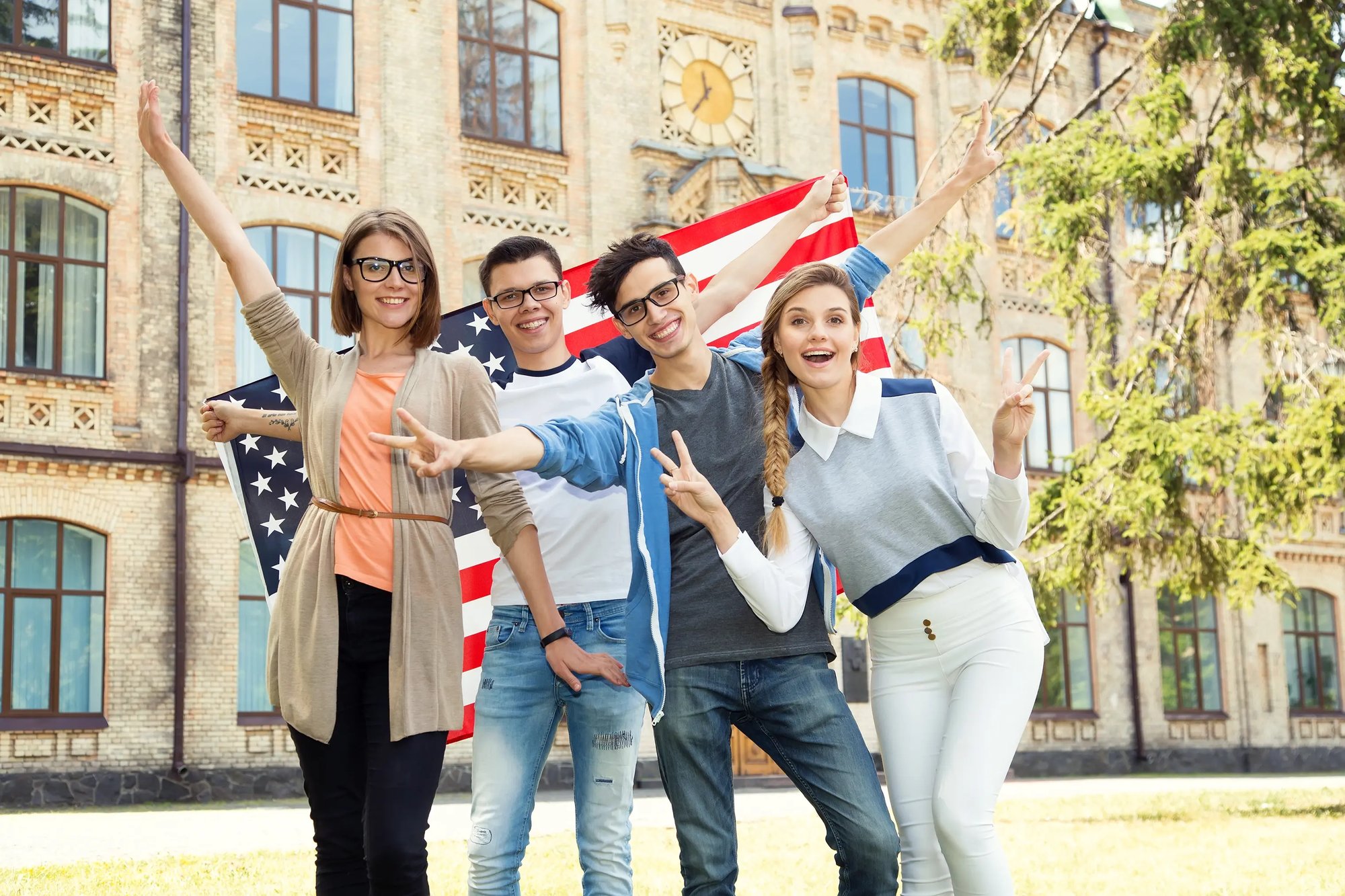 Teens at school with U.S. flag